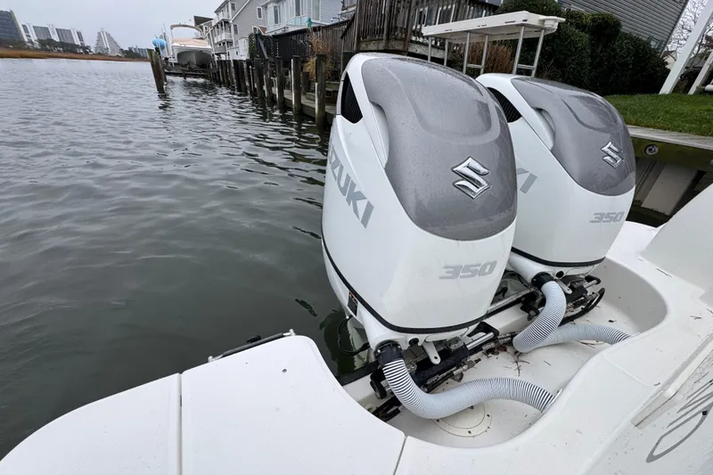 Slide: The Image of Twin Suzuki 350 outboard engines on a 2016 Boston Whaler 315 Conquest boat. - 17