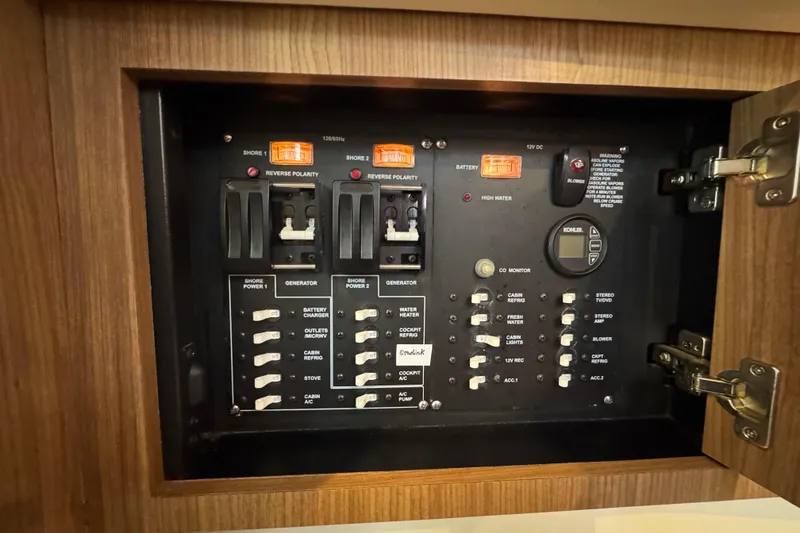 Slide: The Image of Electrical control panel on a 2016 Boston Whaler 315 Conquest boat. - 32