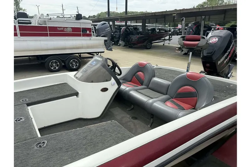 Slide: The Image of 2000 Ranger R81 boat interior with dual seats and steering console. - 3