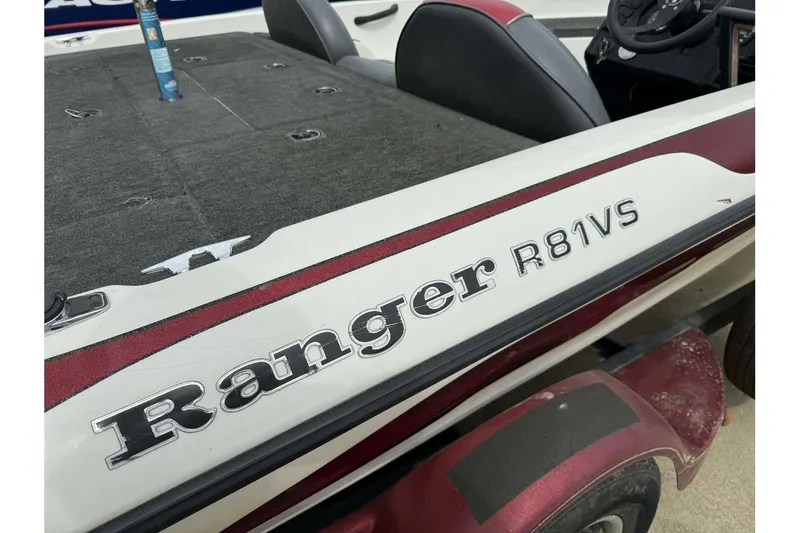 Slide: The Image of 2000 Ranger R81 boat with maroon and white detailing, featuring "R81VS" branding. - 6