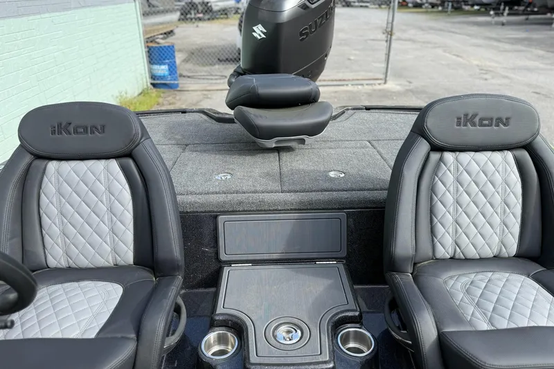 Slide: The Image of 2026 iKon LXE20 boat interior with quilted seats and Suzuki motor. - 10
