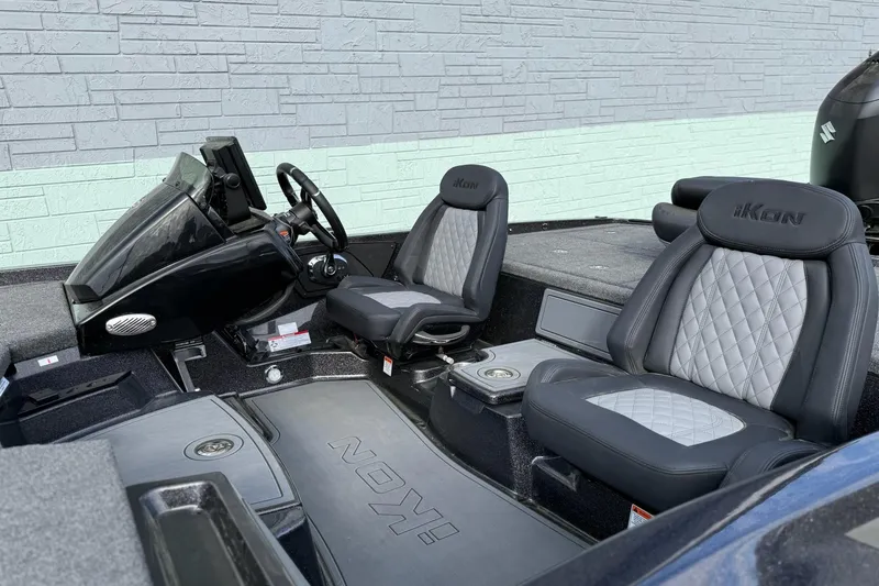 Slide: The Image of 2026 iKon LXE20 boat interior with dual gray seats and steering console. - 9