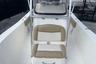 Slide: The Image of 2023 NauticStar 2302 Legacy boat with beige and white seating. - 10