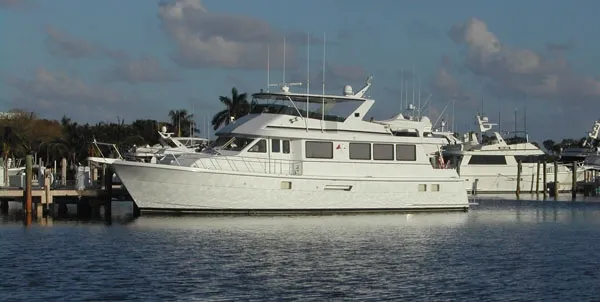 The Image of 1998 Hatteras 74 Sport Deck Motor Yacht docked in harbor. - 0