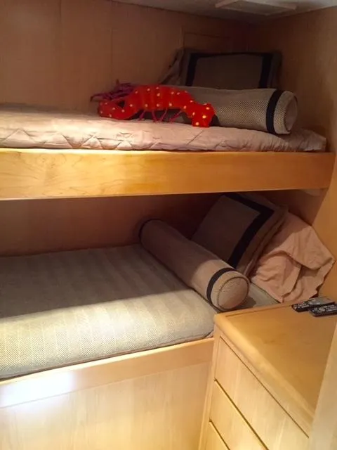Slide: The Image of Interior of 1998 Hatteras 74 Yacht with bunk beds. - 11