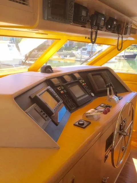 Slide: The Image of 1998 Hatteras 74 Sport Deck yacht helm with navigation equipment. - 15