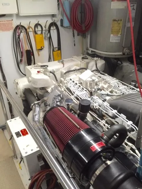 Slide: The Image of Engine room of a 1998 Hatteras 74 Sport Deck yacht with visible machinery. - 21