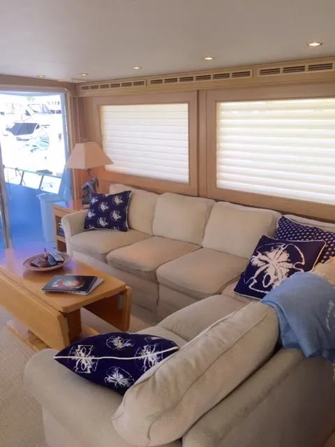 Slide: The Image of Luxurious interior of a 1998 Hatteras 74 Sport Deck yacht with cozy seating. - 5