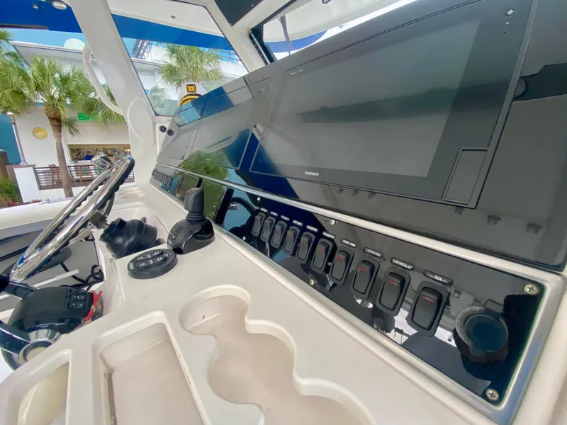 Slide: The Image of Control panel of 2016 Everglades 435 Center Console boat with advanced navigation systems. - 12