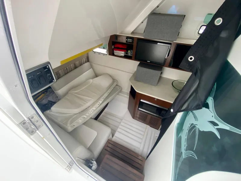 Slide: The Image of Interior cabin of 2016 Everglades 435 Center Console with seating, TV, and storage. - 20