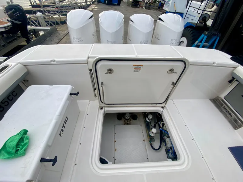 Slide: The Image of 2016 Everglades 435 Center Console boat with open hatch and four outboard engines. - 6