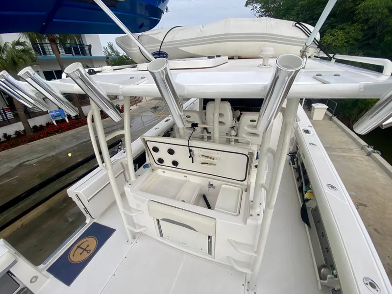 Slide: The Image of 2016 Everglades 435 Center Console boat with fishing rod holders and storage compartments. - 7