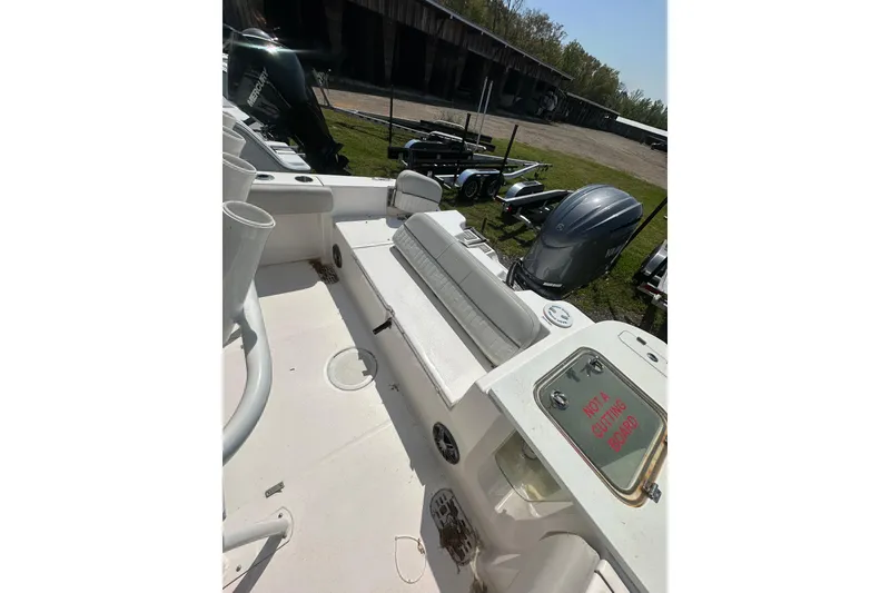 Slide: The Image of 2023 Sea Fox 228 Commander boat interior with motor and storage area. - 12