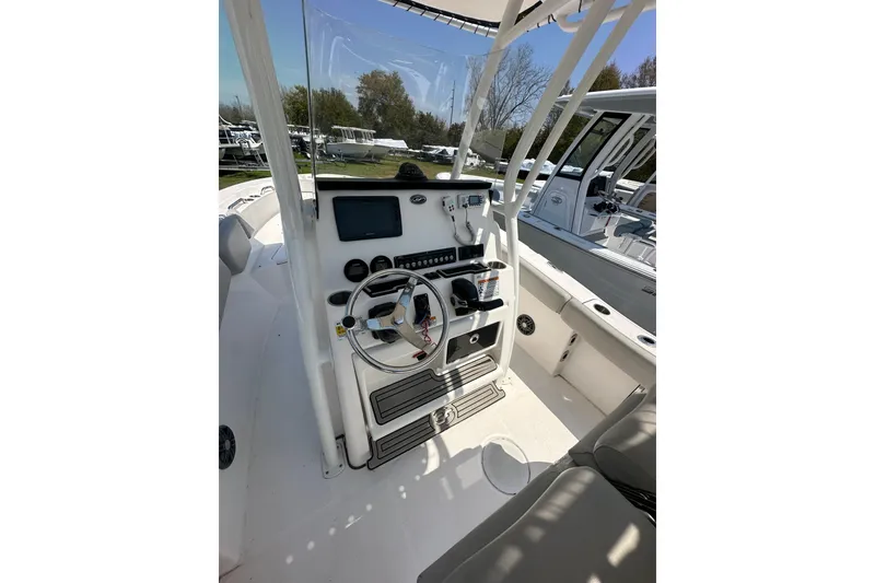 Slide: The Image of 2023 Sea Fox 228 Commander boat cockpit with steering wheel and control panel. - 13