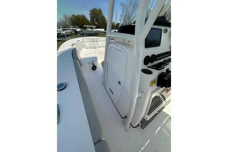 Slide: The Image of 2023 Sea Fox 228 Commander boat interior with console and seating area. - 16