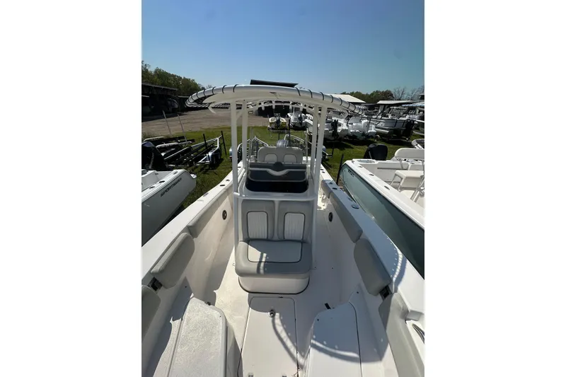 Slide: The Image of 2023 Sea Fox 228 Commander boat interior with seating and console, displayed outdoors. - 9