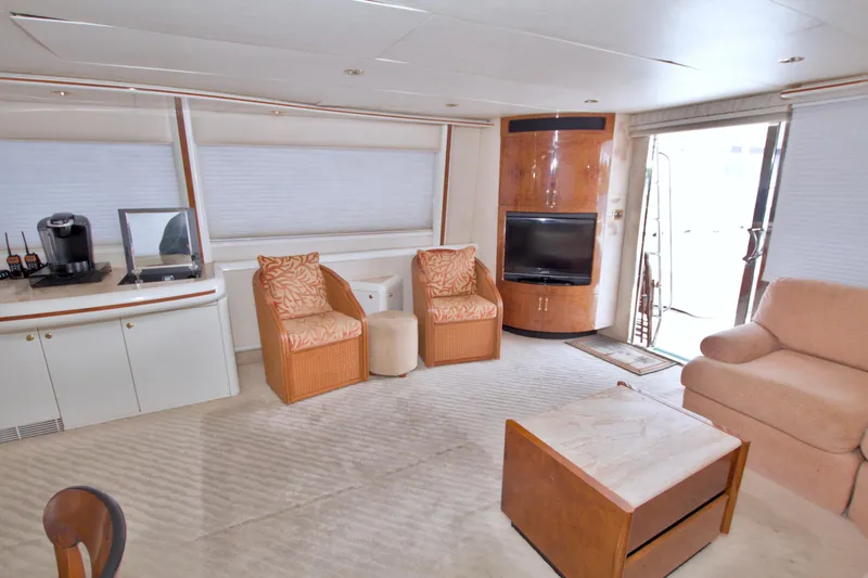 Slide: The Image of Luxurious interior of 1998 Lazzara 76 Skylounge Grand Salon yacht with elegant seating and entertainment area. - 10