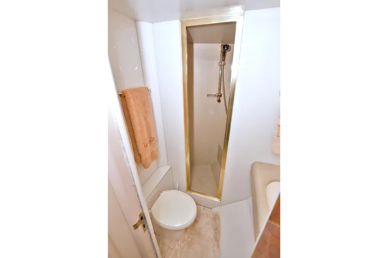 Slide: The Image of Bathroom interior of 1998 Lazzara 76 Skylounge Grand Salon yacht. - 100