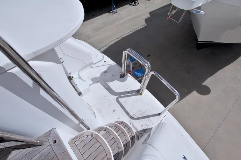 Slide: The Image of 1998 Lazzara 76 Skylounge Grand Salon yacht deck with stainless steel railings. - 102