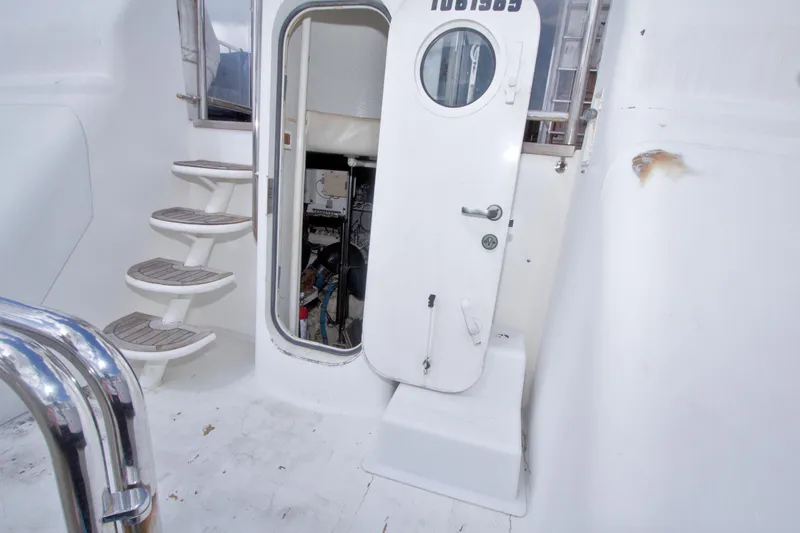 Slide: The Image of Staircase and door on 1998 Lazzara 76 Skylounge Grand Salon yacht. - 104