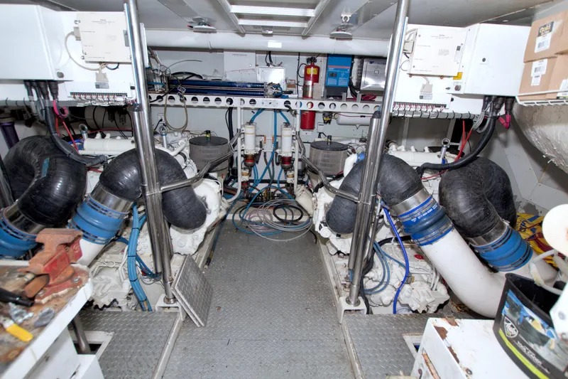 Slide: The Image of Engine room of a 1998 Lazzara 76 Skylounge Grand Salon yacht, showcasing machinery and equipment. - 106