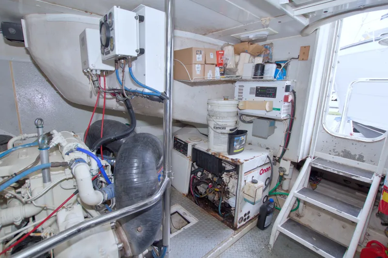 Slide: The Image of Engine room of 1998 Lazzara 76 Skylounge Grand Salon yacht, featuring equipment and storage. - 108