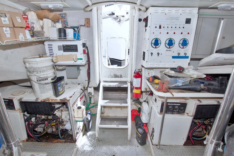 Slide: The Image of Engine room of 1998 Lazzara 76 Skylounge Grand Salon yacht with equipment and tools. - 109