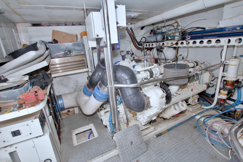 Slide: The Image of Engine room of a 1998 Lazzara 76 Skylounge Grand Salon yacht, showcasing machinery and equipment. - 111