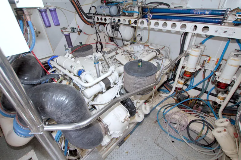 Slide: The Image of Engine room of 1998 Lazzara 76 Skylounge Grand Salon yacht, showcasing mechanical components. - 112