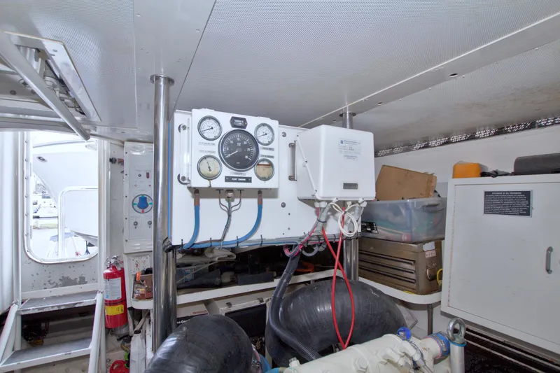 Slide: The Image of Engine room of 1998 Lazzara 76 Skylounge Grand Salon yacht with gauges and equipment. - 113