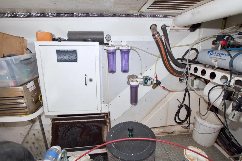 Slide: The Image of Engine room of 1998 Lazzara 76 Skylounge Grand Salon yacht with equipment and storage. - 114