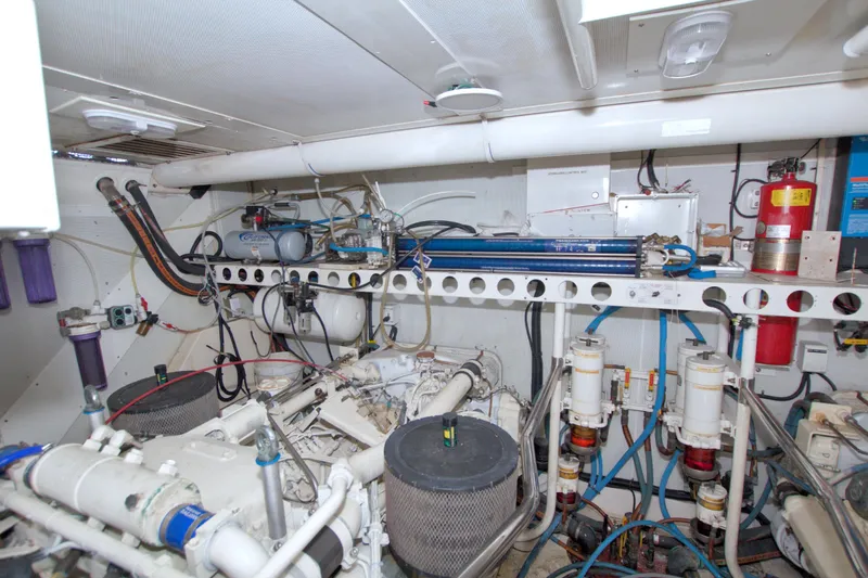 Slide: The Image of Engine room of 1998 Lazzara 76 Skylounge Grand Salon yacht, showcasing mechanical components. - 115