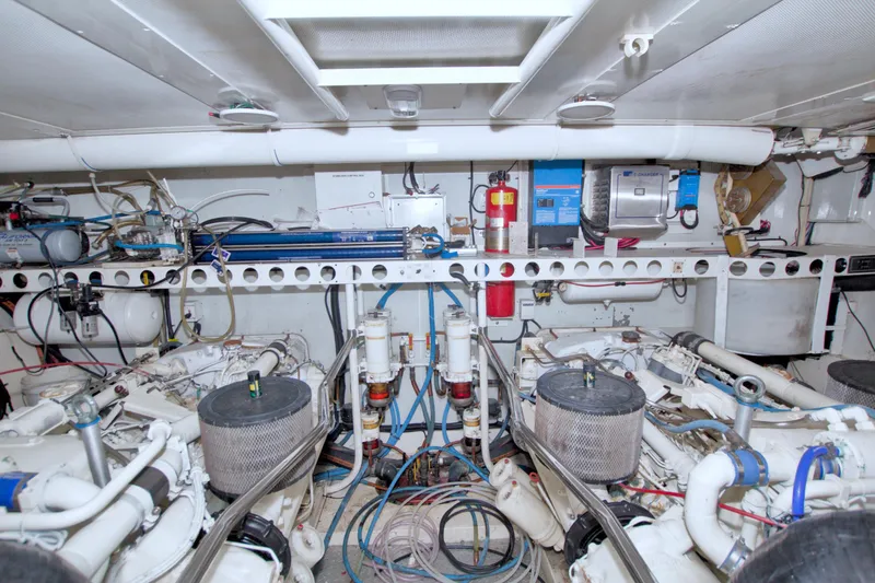 Slide: The Image of Engine room of 1998 Lazzara 76 Skylounge Grand Salon yacht, showcasing mechanical components and systems. - 116