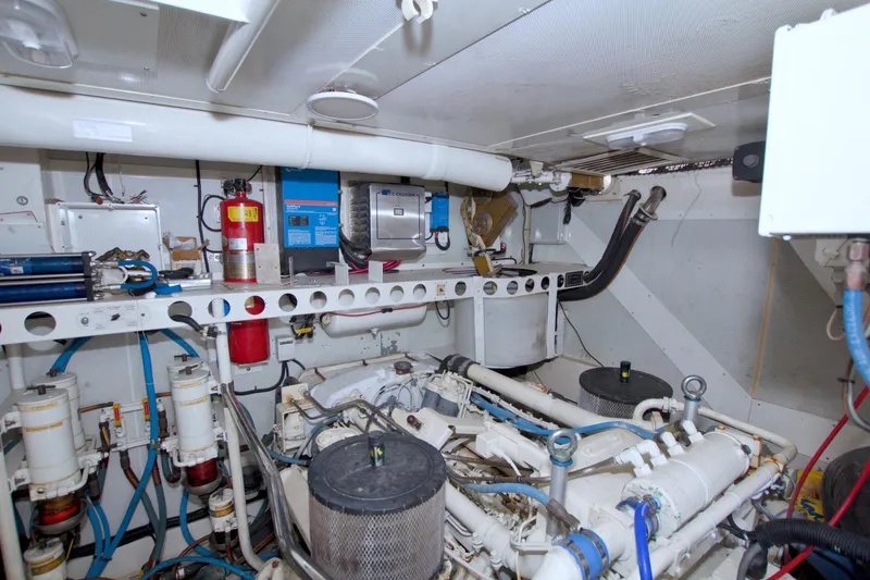 Slide: The Image of Engine room of 1998 Lazzara 76 Skylounge Grand Salon yacht, featuring mechanical equipment and systems. - 117