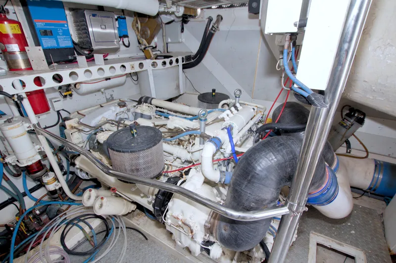 Slide: The Image of Engine room of 1998 Lazzara 76 Skylounge Grand Salon yacht, featuring mechanical components. - 118