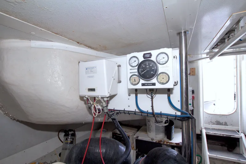 Slide: The Image of Engine room of 1998 Lazzara 76 Skylounge Grand Salon with gauges and equipment. - 119