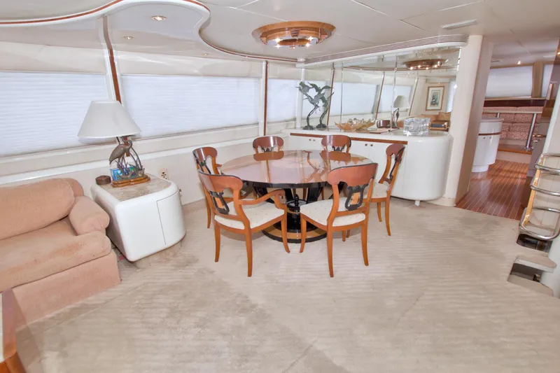 Slide: The Image of Luxurious interior of 1998 Lazzara 76 Skylounge Grand Salon yacht with elegant dining area. - 12