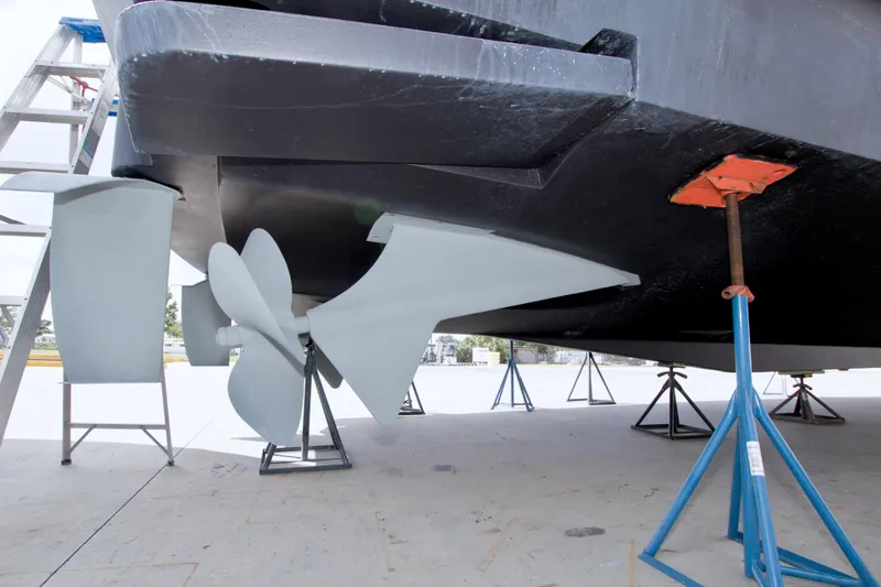 Slide: The Image of Propeller and rudder of 1998 Lazzara 76 Skylounge Grand Salon yacht on stands. - 125