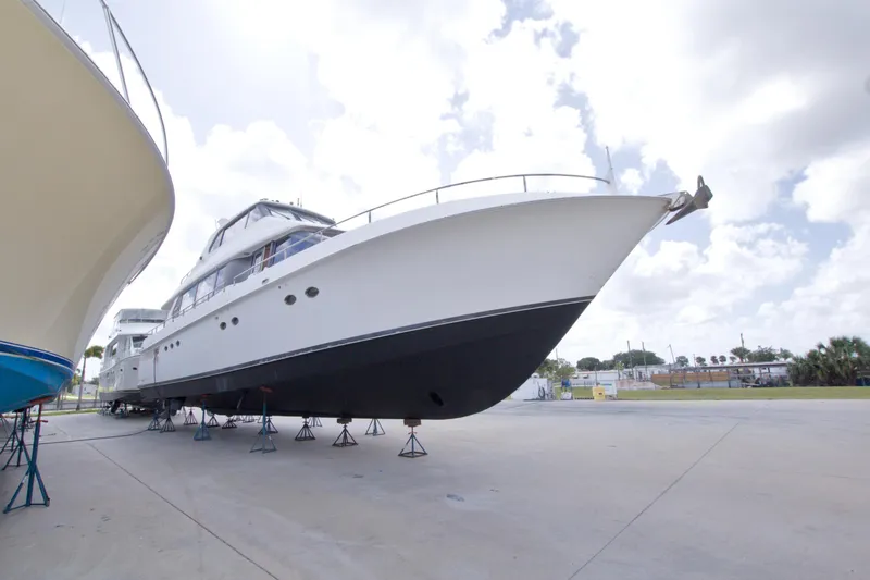 Slide: The Image of 1998 Lazzara 76 Skylounge Grand Salon yacht on stands, outdoor storage. - 127