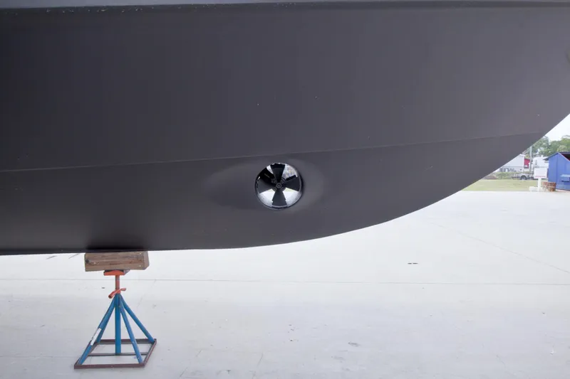 Slide: The Image of Close-up of 1998 Lazzara 76 Skylounge Grand Salon hull with bow thruster. - 129