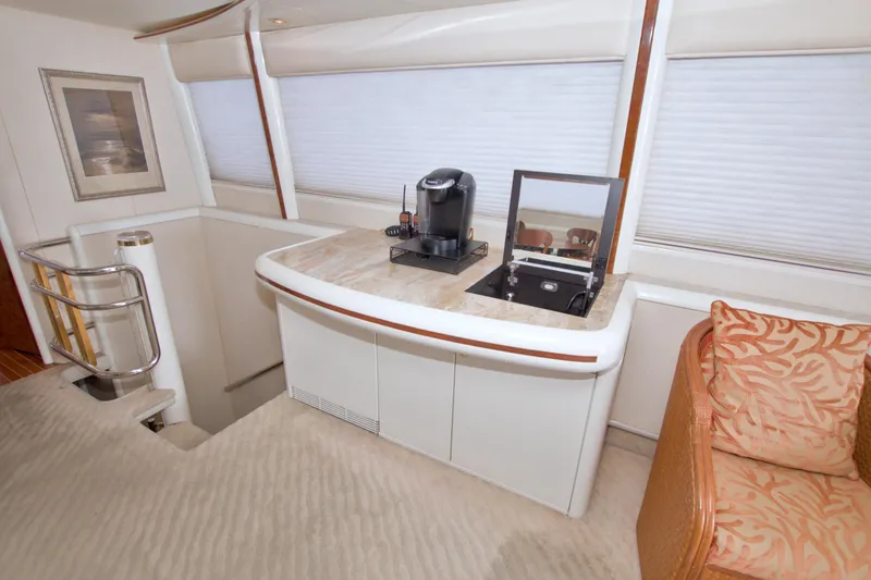 Slide: The Image of Luxurious interior of 1998 Lazzara 76 Skylounge Grand Salon yacht with coffee station. - 14