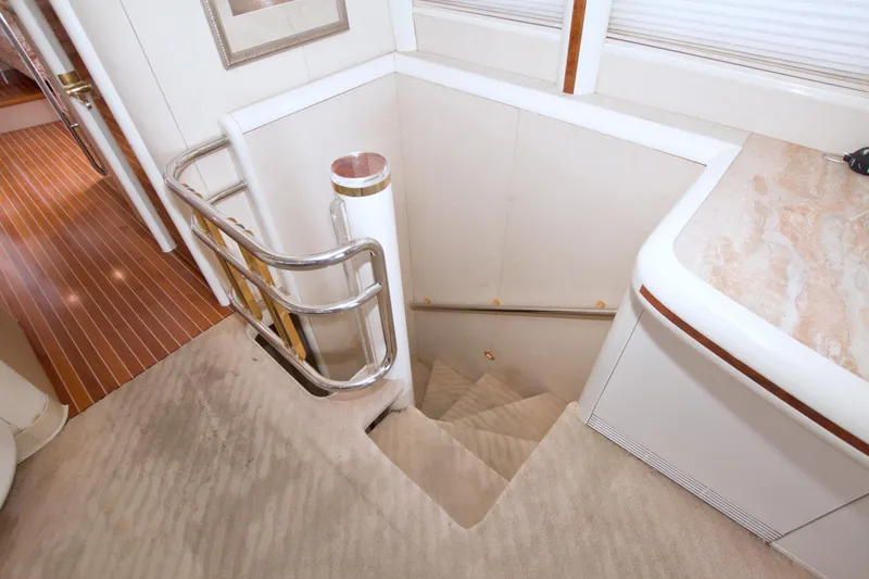 Slide: The Image of Staircase in 1998 Lazzara 76 Skylounge Grand Salon yacht with elegant interior design. - 15