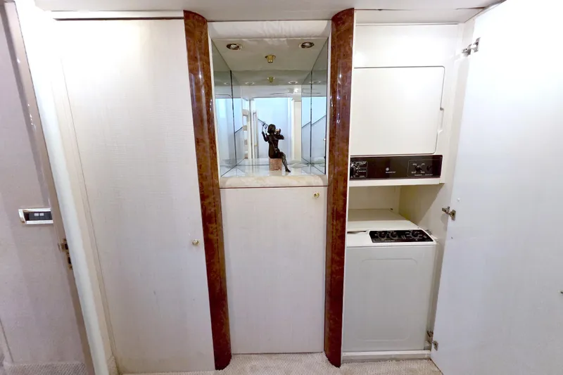 Slide: The Image of Laundry area in 1998 Lazzara 76 Skylounge Grand Salon yacht with mirrored cabinet. - 16