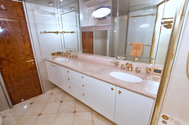 Slide: The Image of Luxurious bathroom in 1998 Lazzara 76 Skylounge Grand Salon yacht with marble countertops. - 25