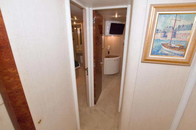 Slide: The Image of Interior hallway of 1998 Lazzara 76 Skylounge Grand Salon yacht with artwork and modern amenities. - 38