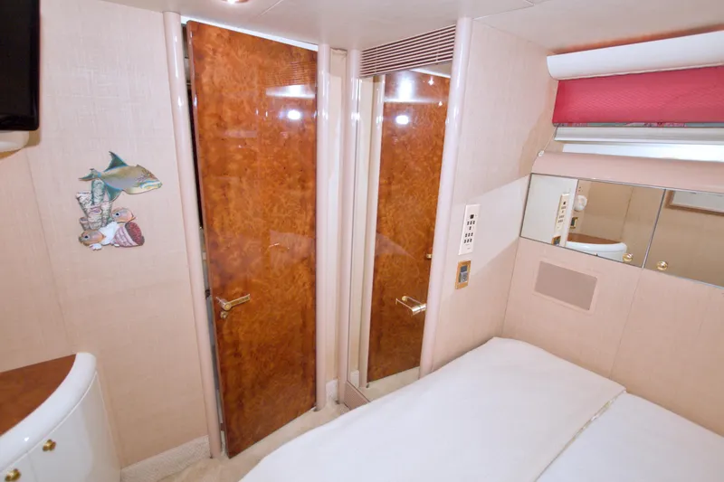 Slide: The Image of Interior of 1998 Lazzara 76 Skylounge Grand Salon yacht bedroom with wooden door. - 41