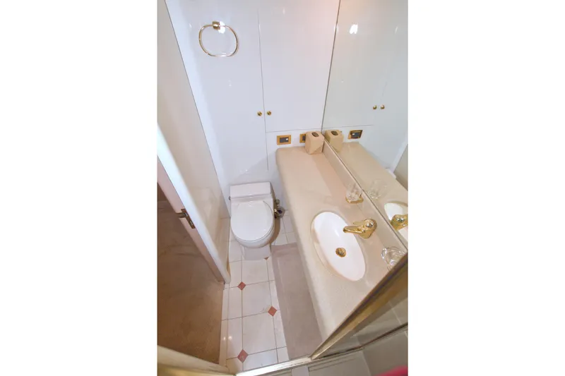 Slide: The Image of Bathroom interior of 1998 Lazzara 76 Skylounge Grand Salon yacht, featuring elegant fixtures. - 43