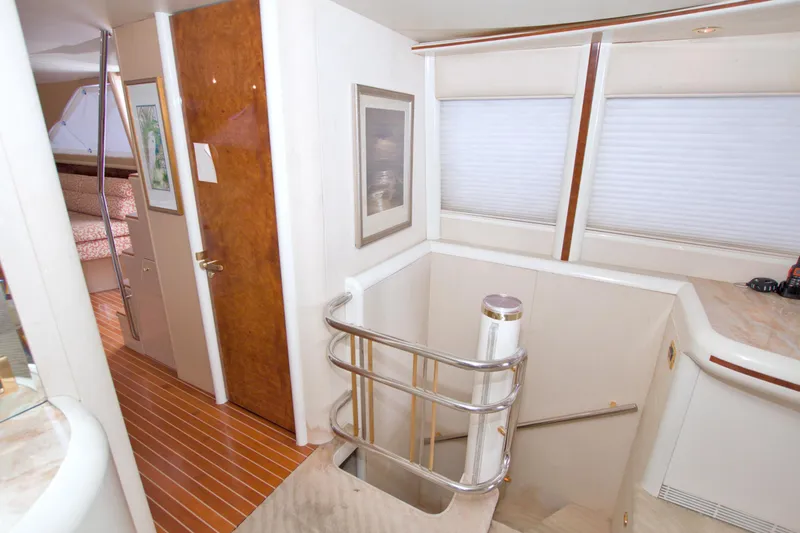 Slide: The Image of Interior of 1998 Lazzara 76 Skylounge Grand Salon yacht, featuring elegant wood and modern design. - 45