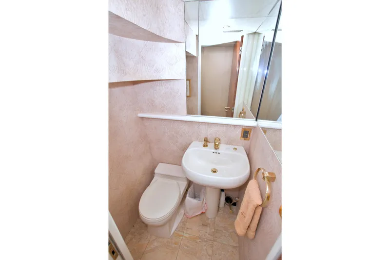 Slide: The Image of Bathroom interior of 1998 Lazzara 76 Skylounge Grand Salon yacht, featuring elegant fixtures. - 46
