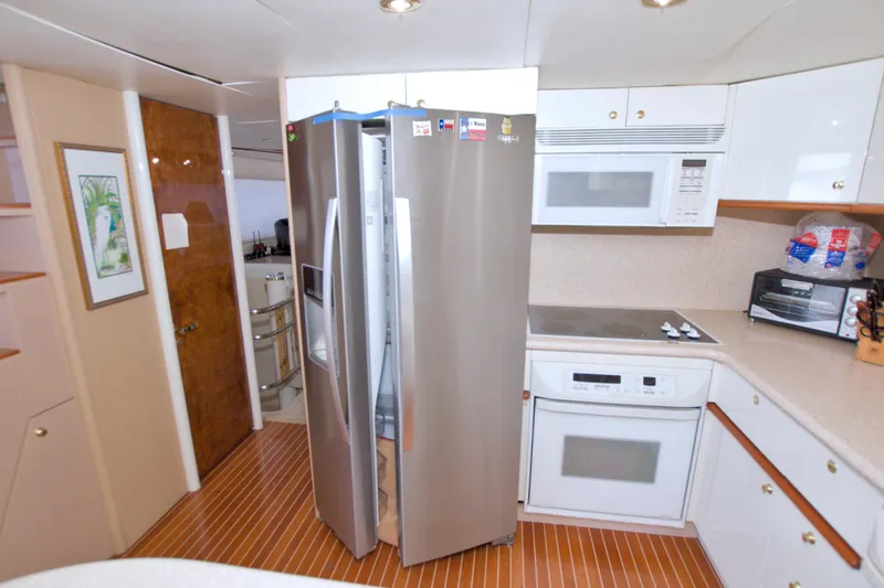 Slide: The Image of Modern kitchen in 1998 Lazzara 76 Skylounge Grand Salon yacht with stainless steel appliances. - 48